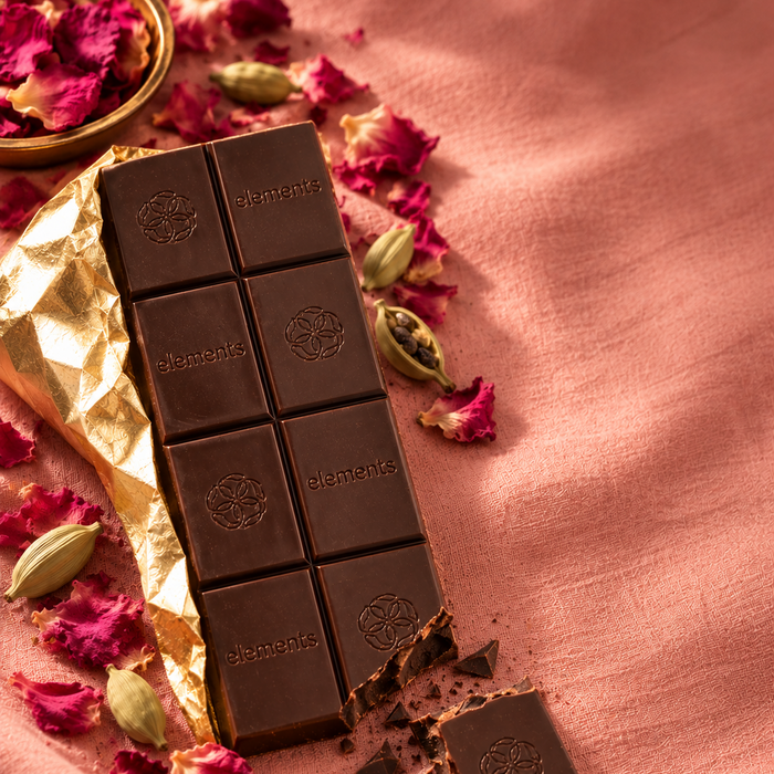 Rose Cardamom bar on gold foil with rose petals and cardamom pods